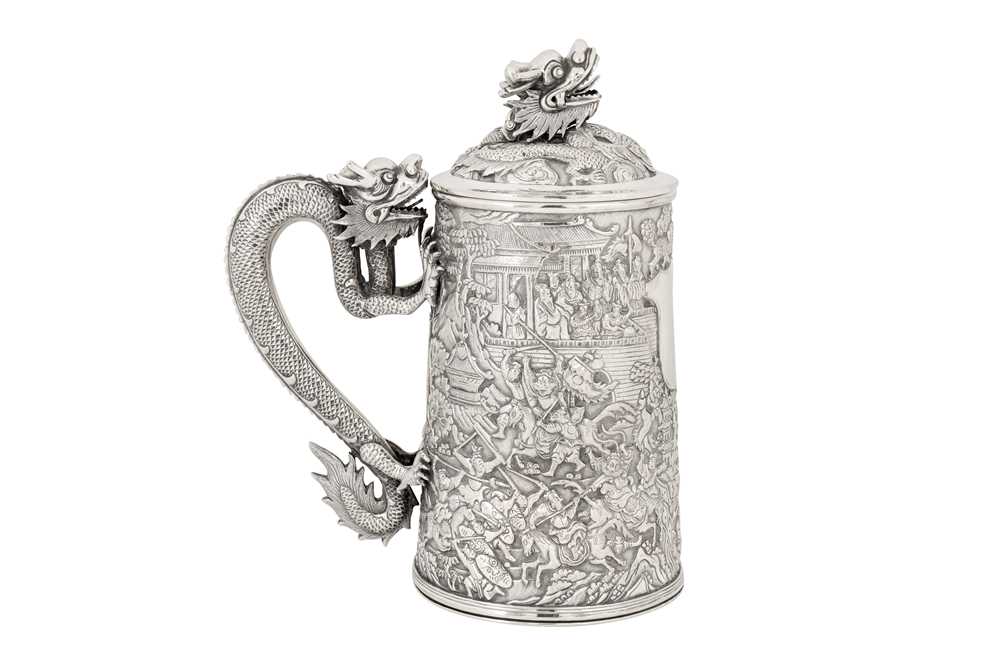 A large late 19th century Chinese Export silver lidded mug or tankard, Canton circa 1880 by Qiu Ji, retailed by Lee Ching of Canton and later Hong Kong