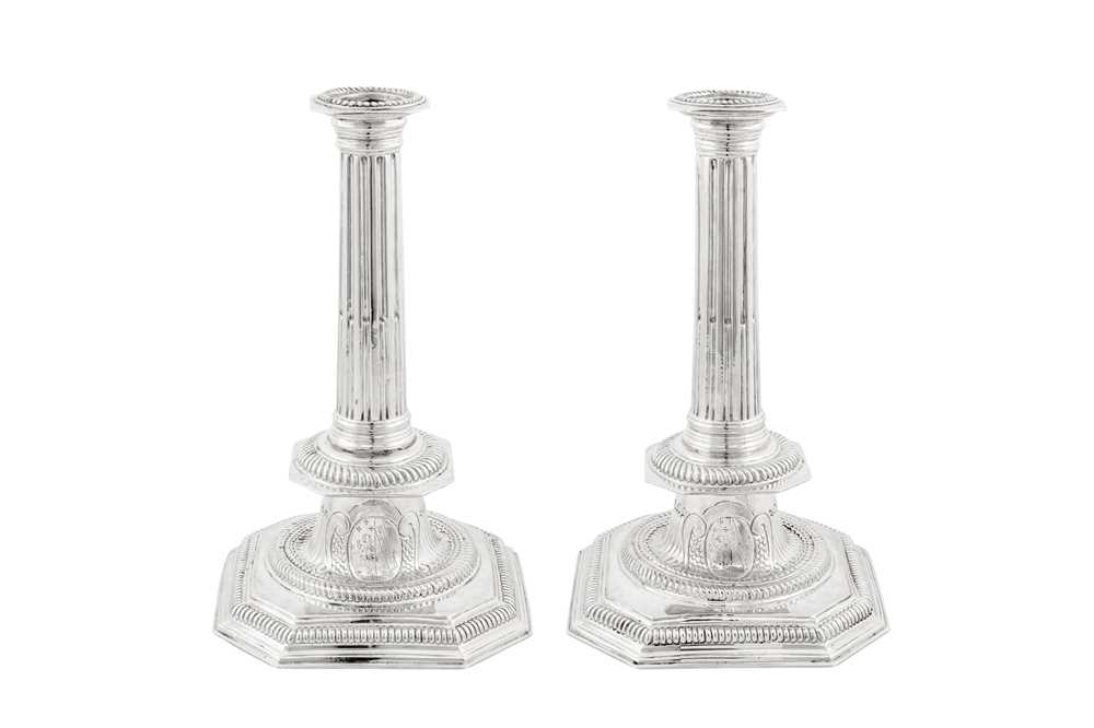 A large pair of Queen Anne Britannia standard silver candlesticks, London 1705 by John Barnard I