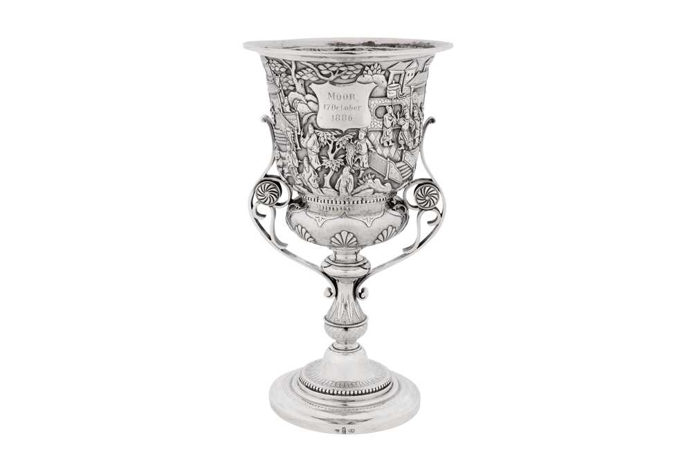 A late 19th century Chinese export silver standing cup, Canton dated 1886 marked Quan Ji, retailed by Wang Hing