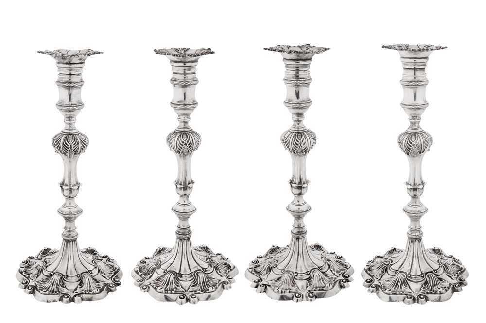 A set of four George III sterling silver candlesticks, London 1765 by Ebenezeer Coker