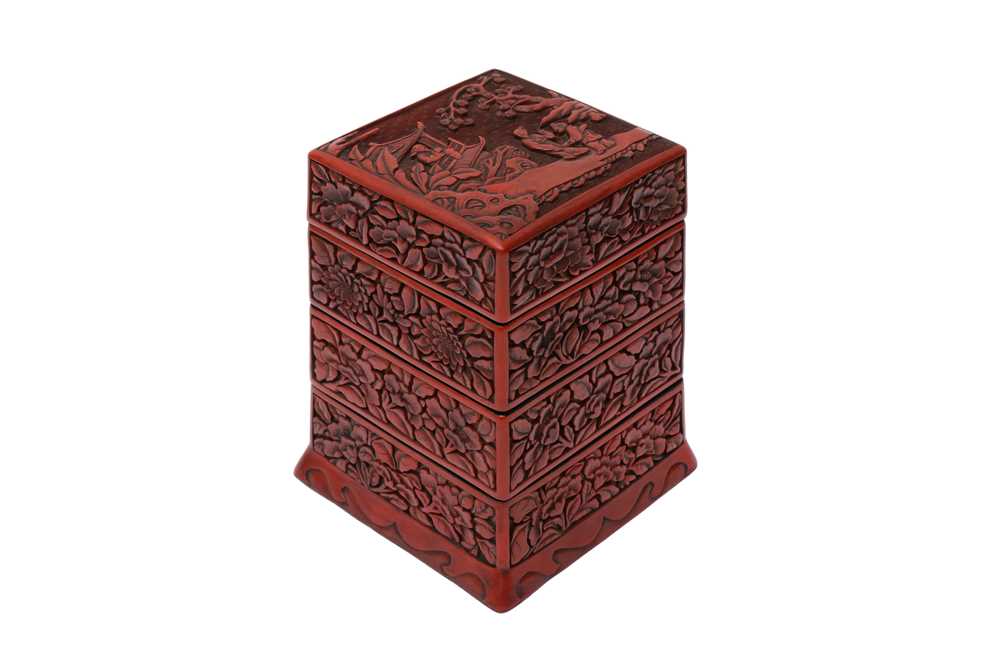 A CHINESE CINNABAR LACQUER TIERED BOX AND COVER