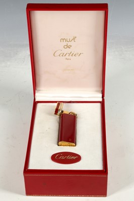 Lot 126 - A Must de Cartier cigarette lighter, burgundy...