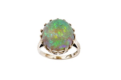 Lot 89 - An opal ring The oval cabochon opal, claw-set...