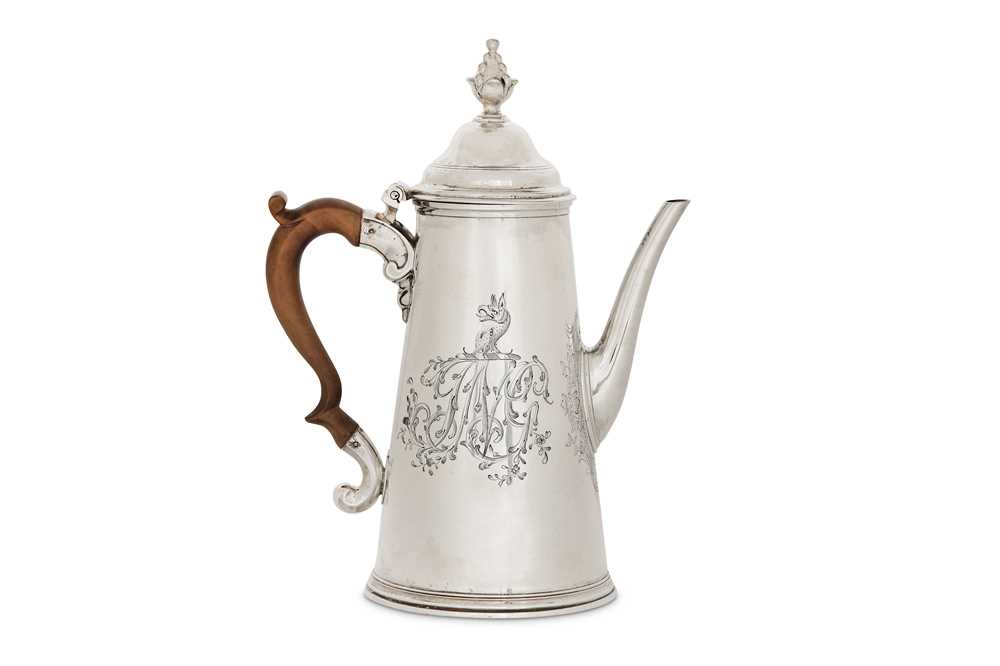 Lot 57 - A George II sterling silver coffee pot, London...