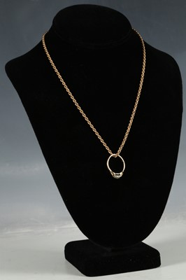 Lot 124 - A 9ct rope twist gold necklace and a dress 9ct...