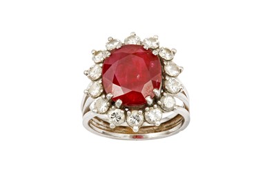 Lot 56 - A ruby and diamond cluster ring The...