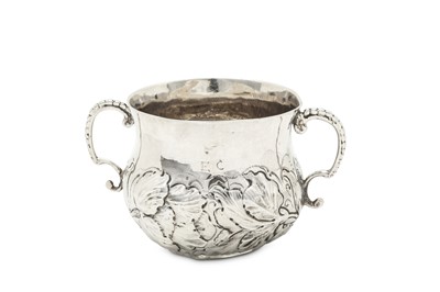 Lot 497 - A Charles II sterling silver twin handled...