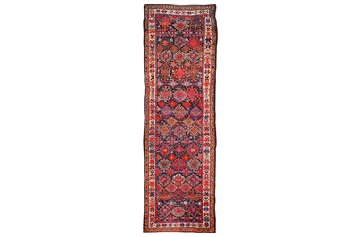 Lot 43 - AN ANTIQUE KURDISH RUNNER approx: 12ft.3in. x...