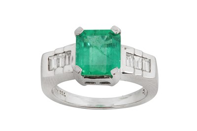 Lot 81 - An emerald and diamond ring The rectangular...