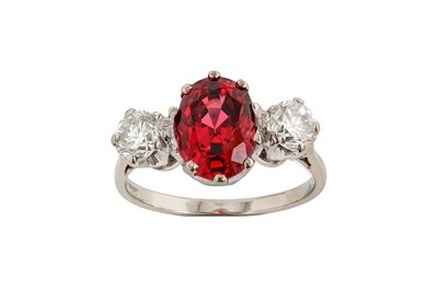 Lot 46 - A spinel and diamond three-stone ring The oval-...