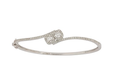 Lot 115 - A diamond-set bangle Of crossover design, set...