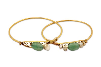 Lot 88 - A pair of gem-set bangles with pearls, one...