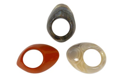 Lot 884 - THREE CARVED HARDSTONE ARCHERS' RINGS  India,...