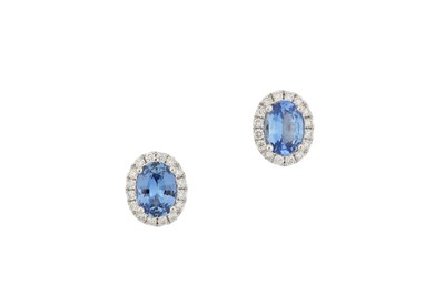 Lot 147 - A pair of sapphire and diamond earstuds Each...