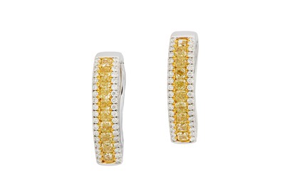 Lot 55 - A pair of yellow diamond and diamond hoop...