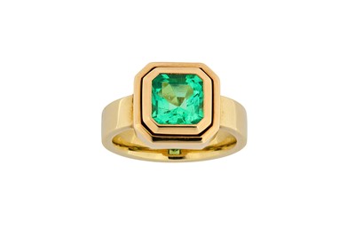 Lot 202 - An emerald ring The square cut-corner step-cut...