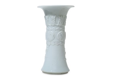 Lot 76 - A CHINESE MOULDED WHITE-GLAZED VASE, GU. Qing...