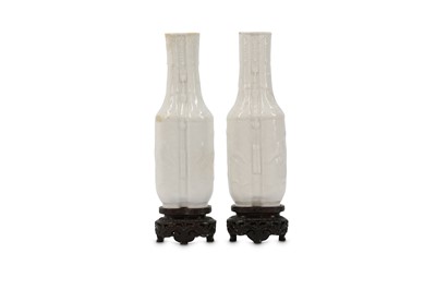 Lot 656 - A PAIR OF CHINESE WHITE-GLAZED CONJOINED VASES....