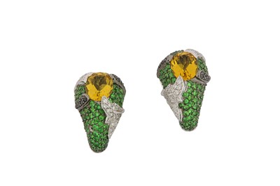 Lot 82 - A pair of gem-set earrings Each oval-cut...