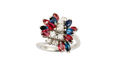 Lot 218 - A sapphire, ruby and diamond ring. diamonds...