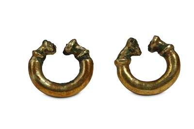 Lot 80 - A PAIR OF WESTERN ASIATIC GOLD ON BRONZE...