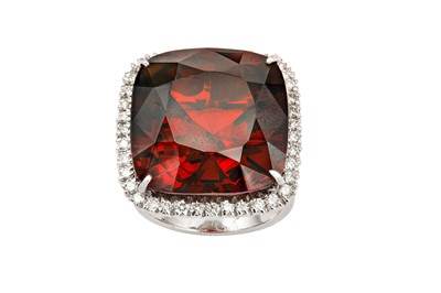 Lot 51 - A garnet and diamond cluster ring The square...