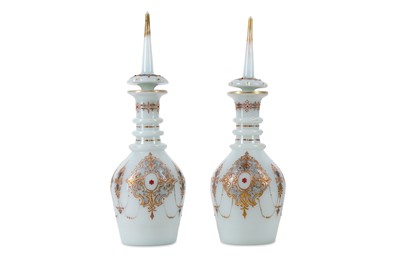 Lot 180 - A PAIR OF OPALINE GLASS DECANTERS FOR THE...