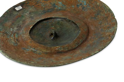 Lot 99 - A WESTERN ASIATIC BRONZE SHIELD FITTING  Circa...