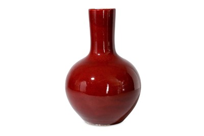 Lot 144 - A Chinese ox blood glazed bottle vase, the...