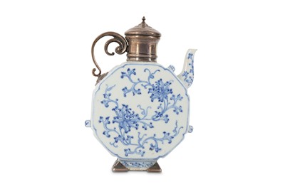 Lot 580 - A CHINESE BLUE AND WHITE ‘LOTUS’ EWER. Qing...