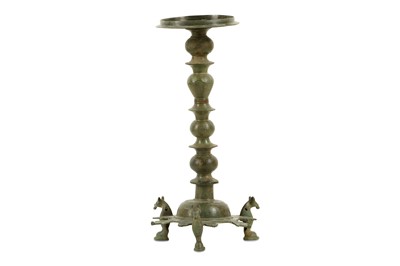 Lot 103 - A BRONZE THREE-FOOTED OIL LAMP STAND Iran,...