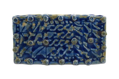 Lot 116 - A BLUE-GLAZED MOULDED STONEPASTE BRICK Iran,...