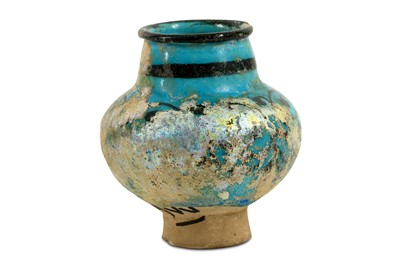 Lot 114 - A SMALL BLACK-PAINTED TURQUOISE-GLAZED JAR...