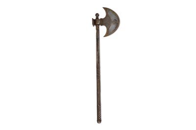 Lot 131 - A QAJAR ENGRAVED AND GOLD-DAMASCENED AXE...