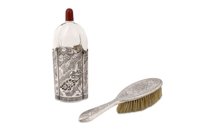 Lot 169 - A LATE QAJAR SILVER BRUSH AND GLASS BOTTLE ...