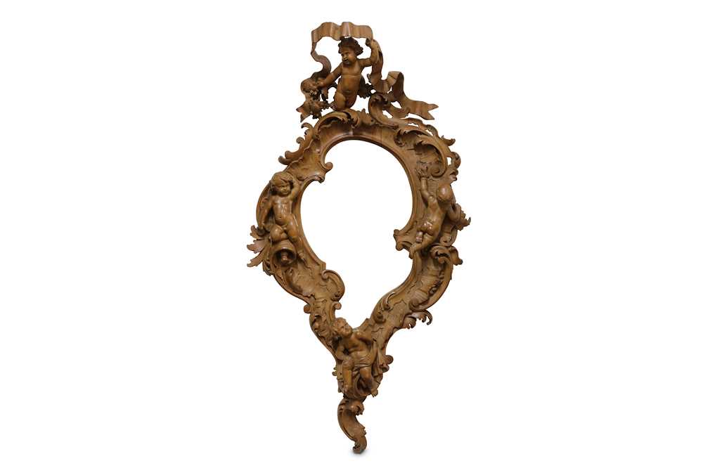 Lot 141 - A LATE 19TH / EARLY 20TH CENTURY CARVED WALNUT...