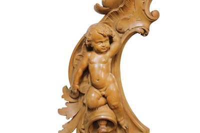 Lot 141 - A LATE 19TH / EARLY 20TH CENTURY CARVED WALNUT...