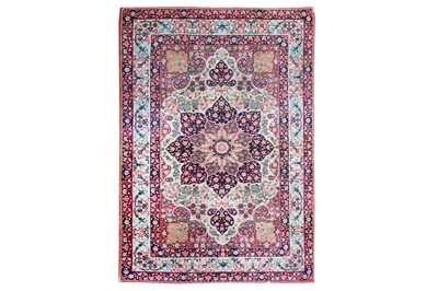 Lot 11 - AN ANTIQUE KIRMAN LAVER RUG, SOUTH PERSIA...