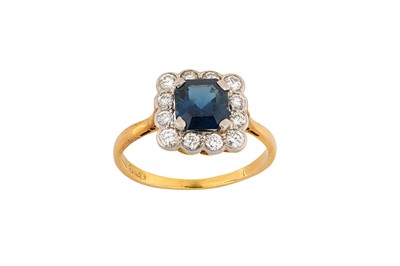 Lot 209 - A sapphire and diamond cluster ring The...