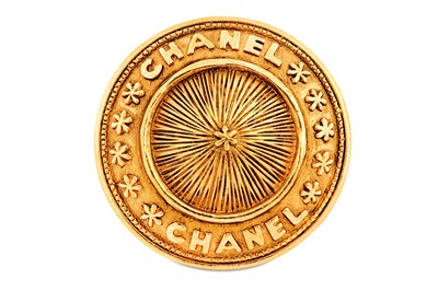 Lot 22 - Chanel Round Gilt Brooch, 1980s, gilt metal...