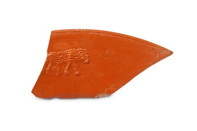Lot 116 - A ROMAN RED-WARE FRAGMENT WITH A RAM Circa 2nd...