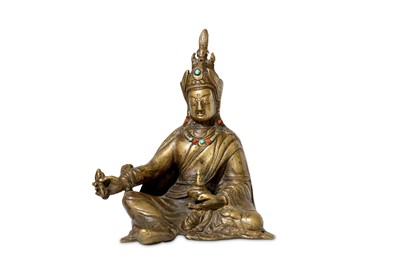 Lot 128 - A Tibetan gilt bronze figure of Pema Jungne,...