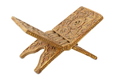 Lot 171 - A CARVED AND GILDED WOODEN QUR'AN STAND...