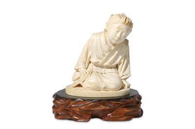 Lot 116 - A Japanese carved ivory figure of a boy Seated...