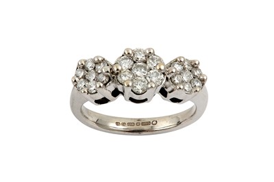 Lot 546 - A diamond dress ring Set with three graduated...