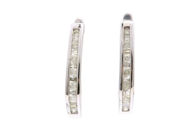 Lot 548 - A pair of diamond earrings Channel-set with...