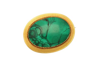 Lot 559 - A malachite brooch The oval cabochon malachite,...