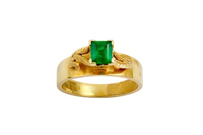 Lot 564 - An emerald ring  The rectangular-cut emerald,...