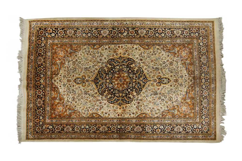 Lot 452 - AN INDIAN RUG