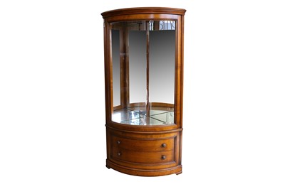 Lot 248 - A cherrywood bow fronted glazed corner display...
